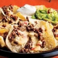 Nacho Fries · Fries Topped with Queso Cheese Sauce, choice of protein, and up to 4 toppings