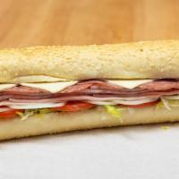 Torpedo Sub · Ham, spiced ham, and hard salami served on Turano bread with lettuce, tomato, onion, our hou...