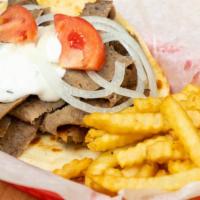 Gyros Plate · Authentic gyro off the vertical broiler. Enough gyro meat to feed two! Comes with two pitas,...