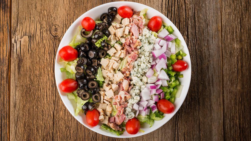 Chopped Salad · Finely chopped Romaine & iceberg lettuce, spinach leaves, grilled chicken, green pepper, red onion, black olives, bacon, grape tomatoes & bleu cheese crumbles. 440 cal.
