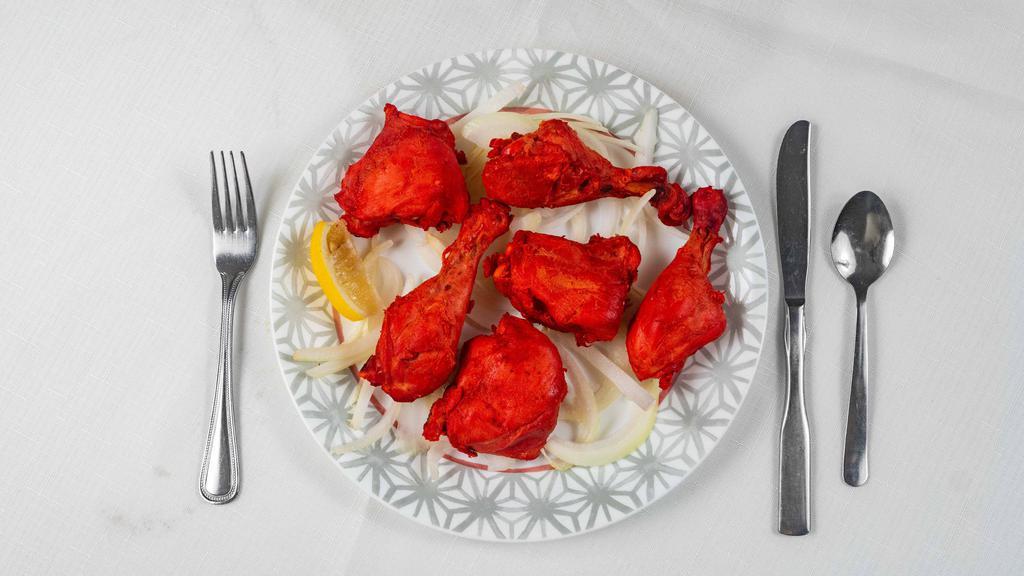 #25. Tandoori Chicken · Chicken marinated in yogurt and mild spices, roasted in our traditional clay oven.
