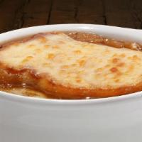 Baked Onion Soup · Topped with a slice of garlic bread and melted provolone.
