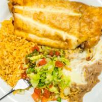 Chimichanga · Choice of savory ground beef or shredded chicken deep-fried, topped with cheese sauce and se...