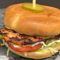 Grilled Chicken Burger · Grilled Chicken, lettuce, tomatoes, pickles, and mayo,
served with fries