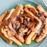 Taffy Apple French Toast · French toast topped with apples, caramel, and nuts.