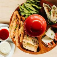 Pupu Platter · Gyoza, edamame, tempura sweet potatoes, spring rolls, and your choice of chicken or pork ste...