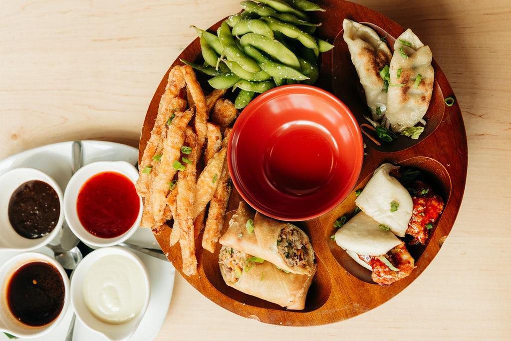 Pupu Platter · Gyoza, edamame, tempura sweet potatoes, spring rolls, and your choice of chicken or pork steamed buns.