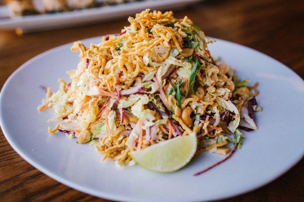 Miso Sesame Chicken Salad · Sliced chicken, shaved red and napa cabbage, green and red onions, cashews, with red curry puffed rice.
