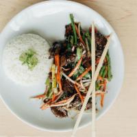 Mongolian Beef · Crispy beef tenderloin in a sweet tangy sauce with carrots, sprouts, and green onions. Serve...