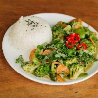 Green Thai Curry · Spicy coconut curry with broccoli, carrots, snow peas, onions and diced potatoes with jasmin...