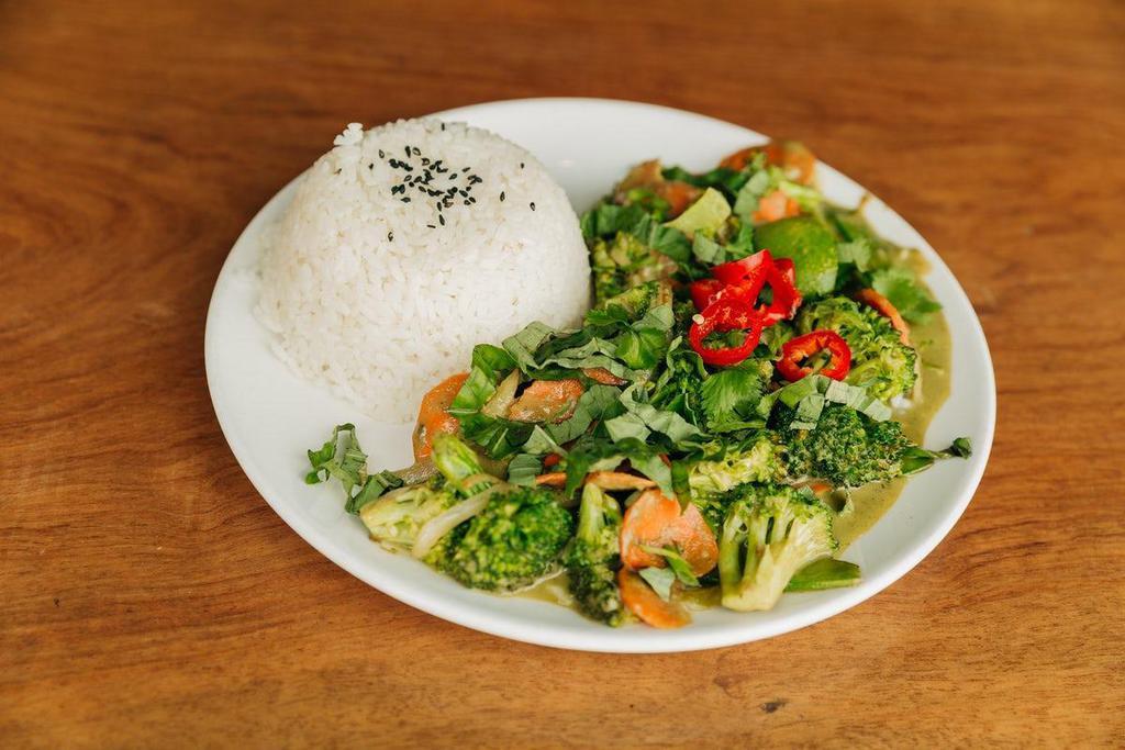 Thai Green Curry · Spicy coconut curry with broccoli, carrots, snow peas, onions and diced potatoes with jasmine rice with basil, cilantro, fresnos and lime.