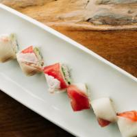 *Rainbow Roll · Crab mix, cucumber and avocado, topped with tuna, salmon, yellowtail, ebi and white fish.