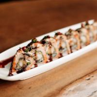 *Roll & Gift · Tempura shrimp, jalapeño and chipotle cream cheese rolled in masago, topped with blackened e...