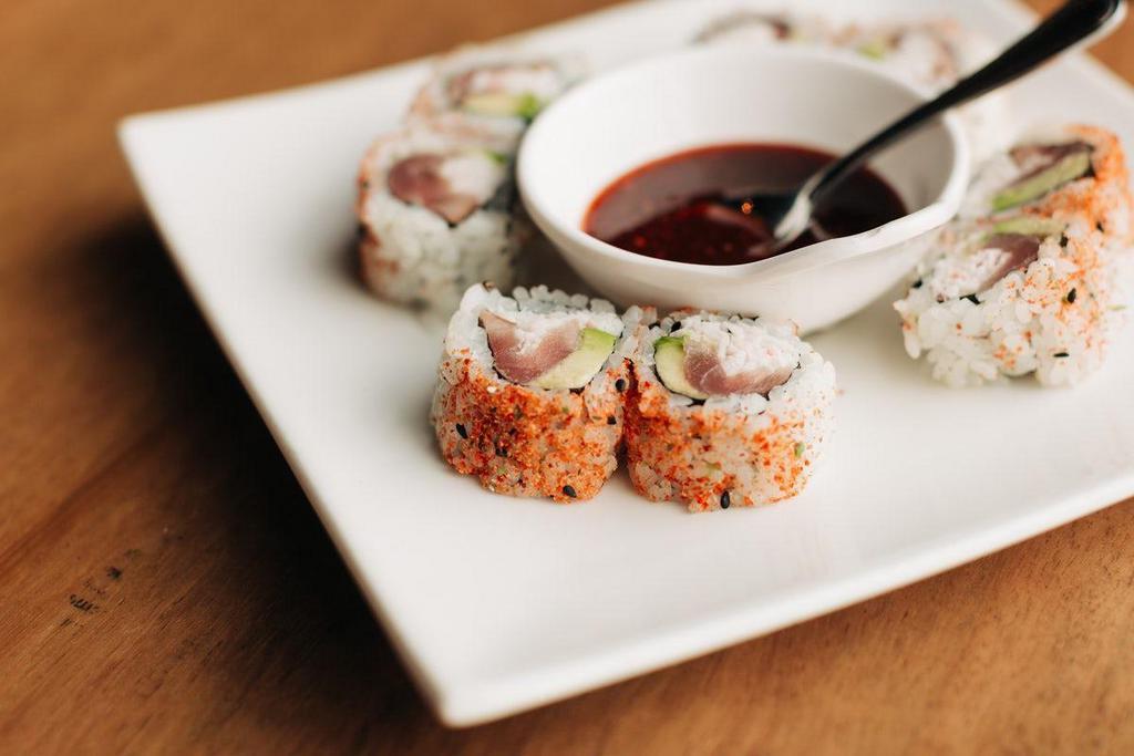 *Geisha'S Demise · Seared yellowfin tuna, avocado, wasabi and crab mix rolled in shichimi pepper with sweet evil sauce.