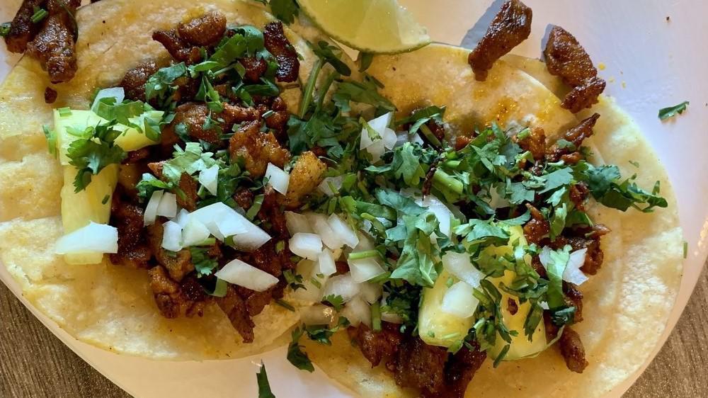 Tacos · Popular dish which consists with your choice of chicken, steak, pastor, chorizo or chicharron topped with onion and cilantro.