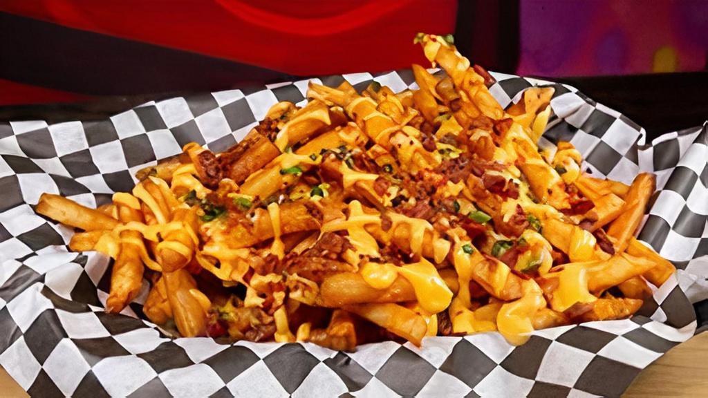 Cheesy Bacon Fries · If you've got the munchies then this is definitely for you! Our signature seasoned fries, layered with cheese sauce, bacon, and chives...