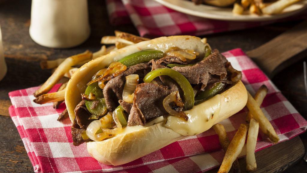 Cheesesteak · Our cheesesteak sandwich is made with crisp lettuce, tomatoes, sautéed onions, and provolone cheese.