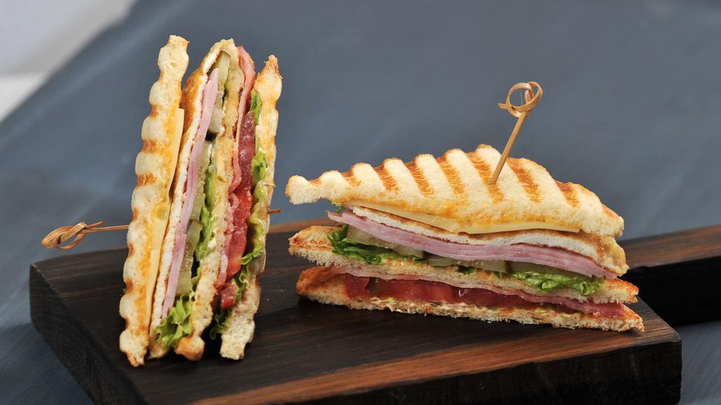 Bacon Flatbread · Freshly cooked crispy bacon and cheese stuffed into a flatbread with fresh lettuce and tomato.