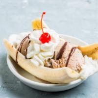 Banana Split · Classic banana split topped with chocolate syrup and crunchy nuts.