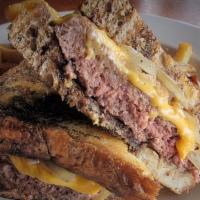 Slap Shot Patty Melt · 1/2 lb. grilled Angus beef burger served on toasted marble rye bread & topped with grilled o...