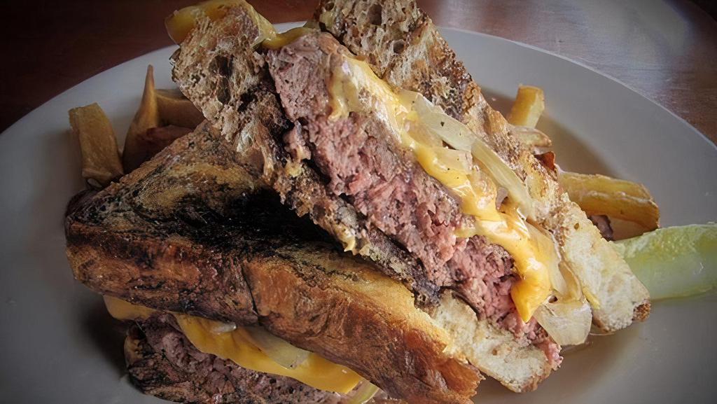 Slap Shot Patty Melt · 1/2 lb. grilled Angus beef burger served on toasted marble rye bread & topped with grilled onions & American cheese.