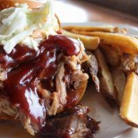 Carolina Style Bbq Pulled Pork · Slow smoked & hand pulled pork tossed in BBQ sauce, served on a brioche bun & topped with co...