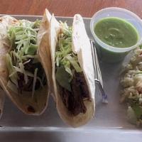 Short Rib Tacos · Topped with green cabbage and served with a side of salsa verde and Spanish rice.  Add a sou...
