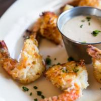 Coconut Shrimp · Baked in our 600 degree oven; ginger-coconut sauce