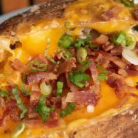 Loaded Baked Potato · Butter, sour cream, cheddar cheese, bacon, scallions.