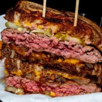 Kaner Melt · patty melt, toasted marble
rye, American cheese,
pickles & seared burger
with grilled onions