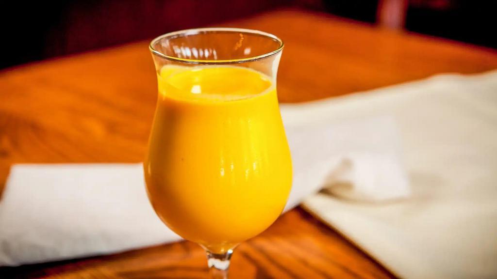 Mango Lassi · Refreshing mango and yogurt drink.