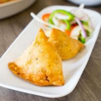 Vegetable Samosas · Two pieces. Pastry puffs with potatoes and peas.