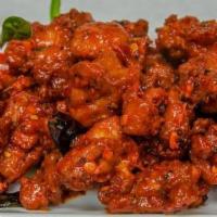 Spicy Chicken Chatpata · Boneless chicken cubes fried with chili paste, soy sauce, and chef’s special sauce.