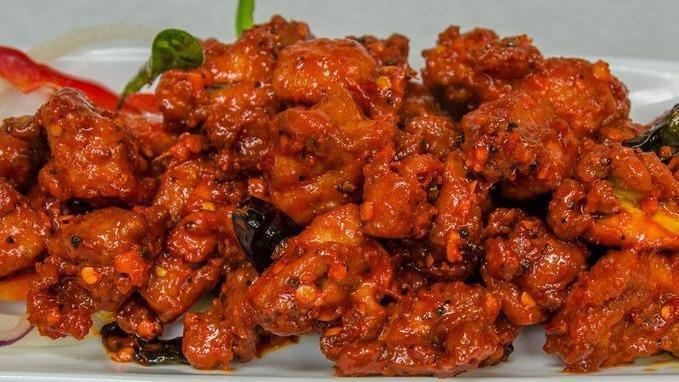Spicy Chicken Chatpata · Boneless chicken cubes fried with chili paste, soy sauce, and chef’s special sauce.