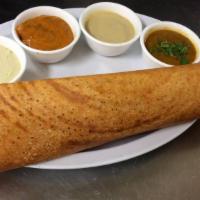 Masala Dosa · Rice and lentil crepes topped with onion and herbed potato curry. Served with lentil soup an...