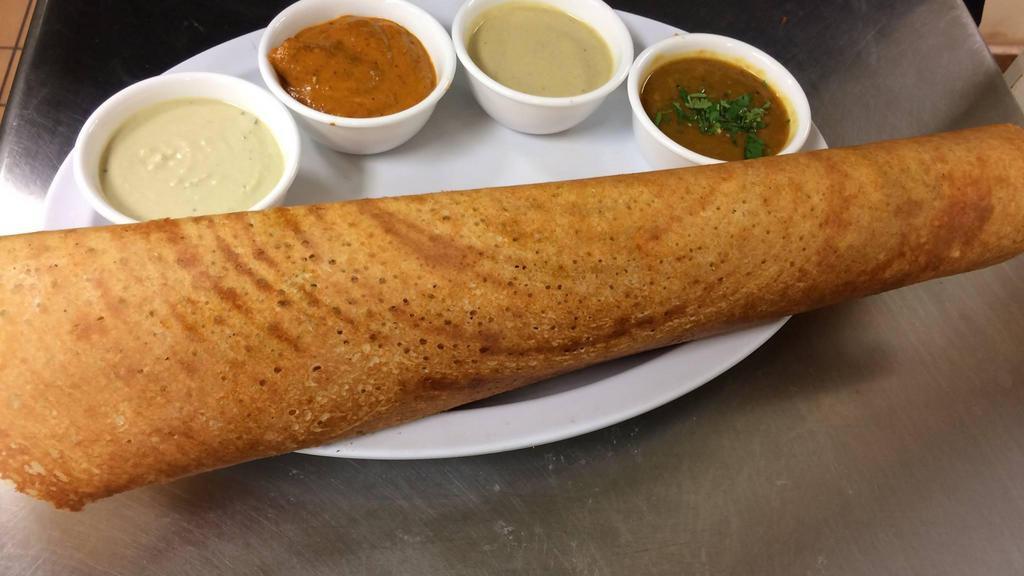 Plain Dosa · Rice and lentil savory crepe. Served with lentil soup and chutney.
