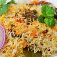 Lamb Biryani · Lamb marinated in spices and herbs and cooked with saffron flavored aromatic basmati rice. S...