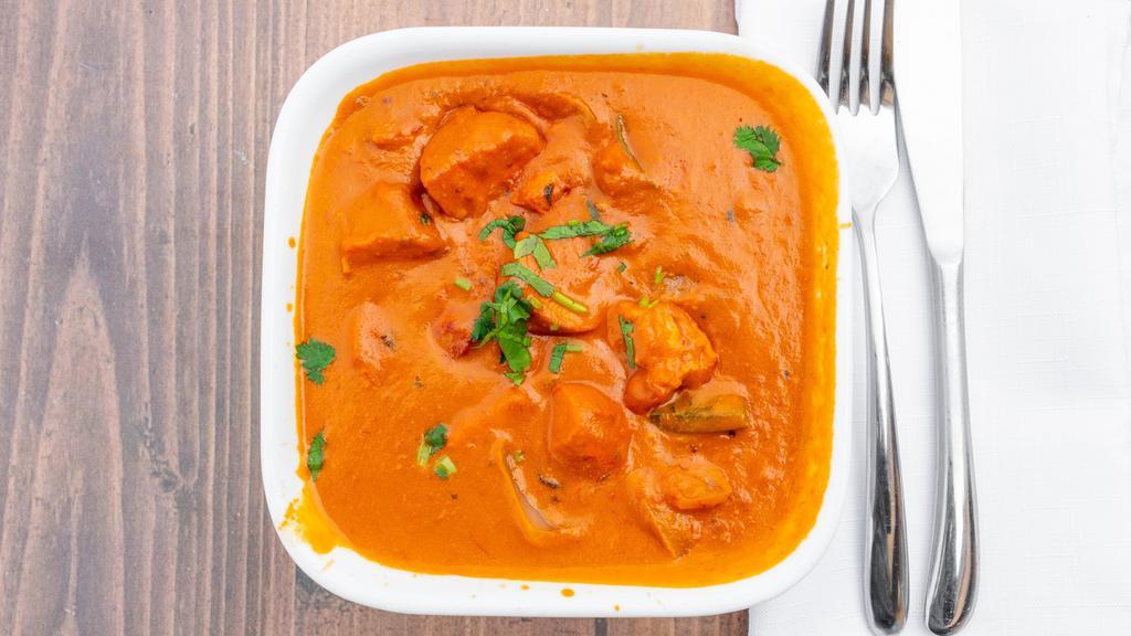 Chicken Tikka Masala · Tandoori chicken chunks cooked in rich red creamy tomato lightly spiced sauce. Served with basmati rice.