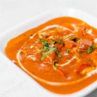 Butter Chicken · Boneless chicken tenders cooked in a touch of butter and creamy tomato sauce. Served with ba...