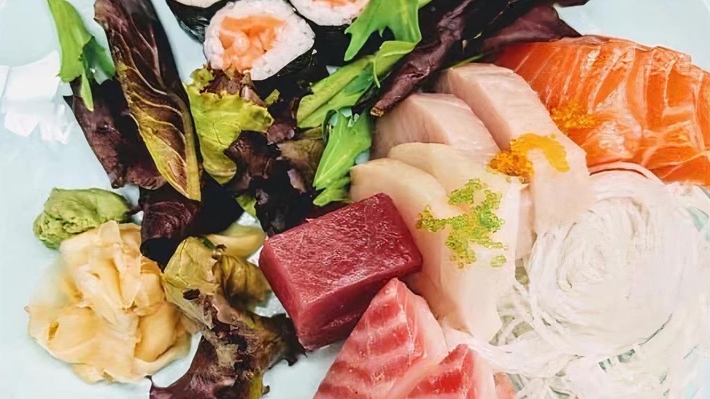 Sashimi Deluxe · Served with 13 assorted raw fish and a salmon roll.
