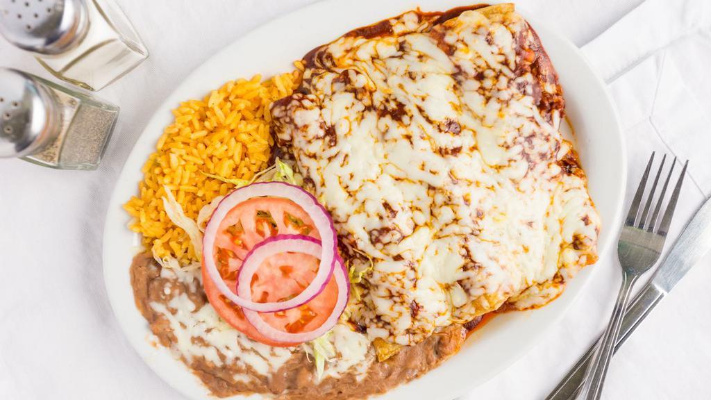 Enchiladas · Fresh corn tortillas stuffed with your choice of chicken or beef topped with our own enchilada sauce, Cheddar cheese. Served with rice and beans, sour cream and salsa.