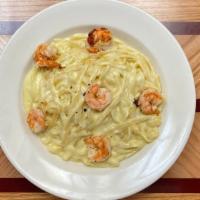 Fettuccini Alfredo With Shrimp · The classic creamy combination of cheese and cream sauce over fettuccine noodles.