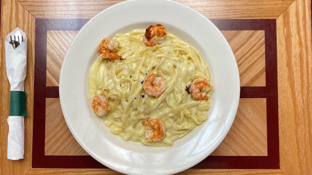 Fettuccini Alfredo With Shrimp · The classic creamy combination of cheese and cream sauce over fettuccine noodles.