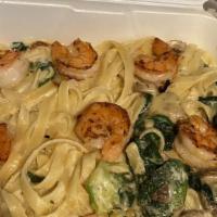 Pasta A La Roma With Shrimp · Tender cuts of chicken breast on top of spinach and fettuccine pasta with fresh broccoli and...