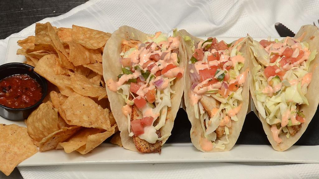 Baja Fish Tacos · Flash-fried or grilled cod, crisp cabbage, fresh pico de gallo, johnny sauce, lime, chips, salsa.