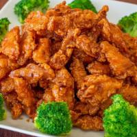 Orange Chicken · Spicy. Chunks of crispy chicken with green onions, dry orange peels, and chili peppers sauté...