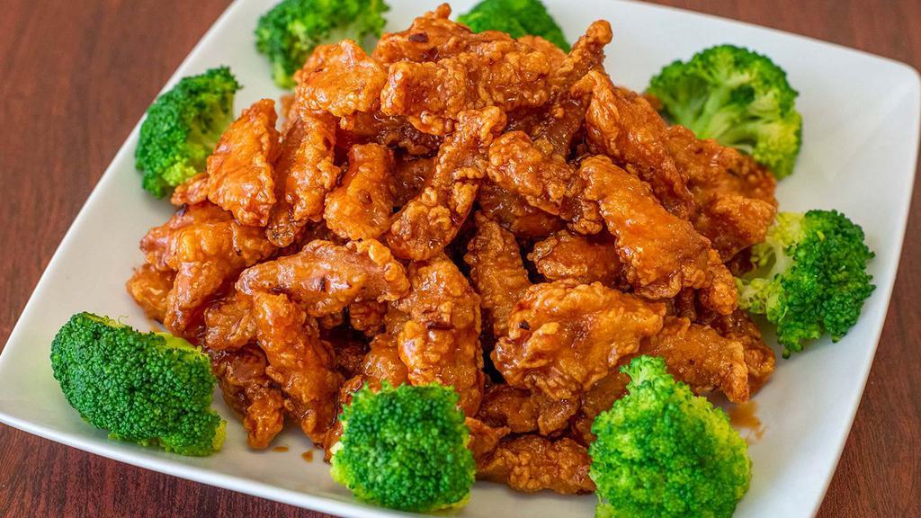 Orange Chicken · Spicy. Chunks of crispy chicken with green onions, dry orange peels, and chili peppers sautéed in a special brown sauce.