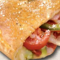 Italian Calzone · Pepperoni, ham, onions, green peppers, tomatoes and mozzarella cheese. Oven-baked fold-over ...