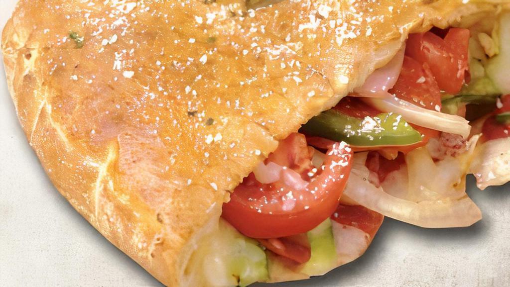 Italian Calzone · Pepperoni, ham, onions, green peppers, tomatoes, and mozzarella cheese.