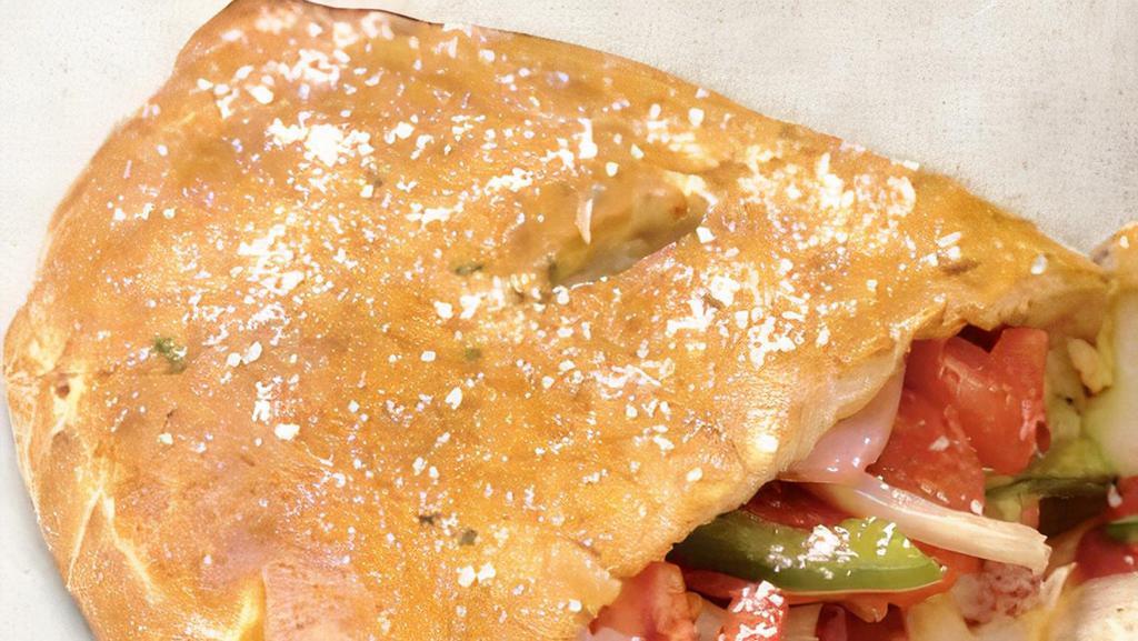 Pizza Calzone · Pepperoni, mushrooms, onions, green peppers, mozzarella cheese, and pizza sauce.